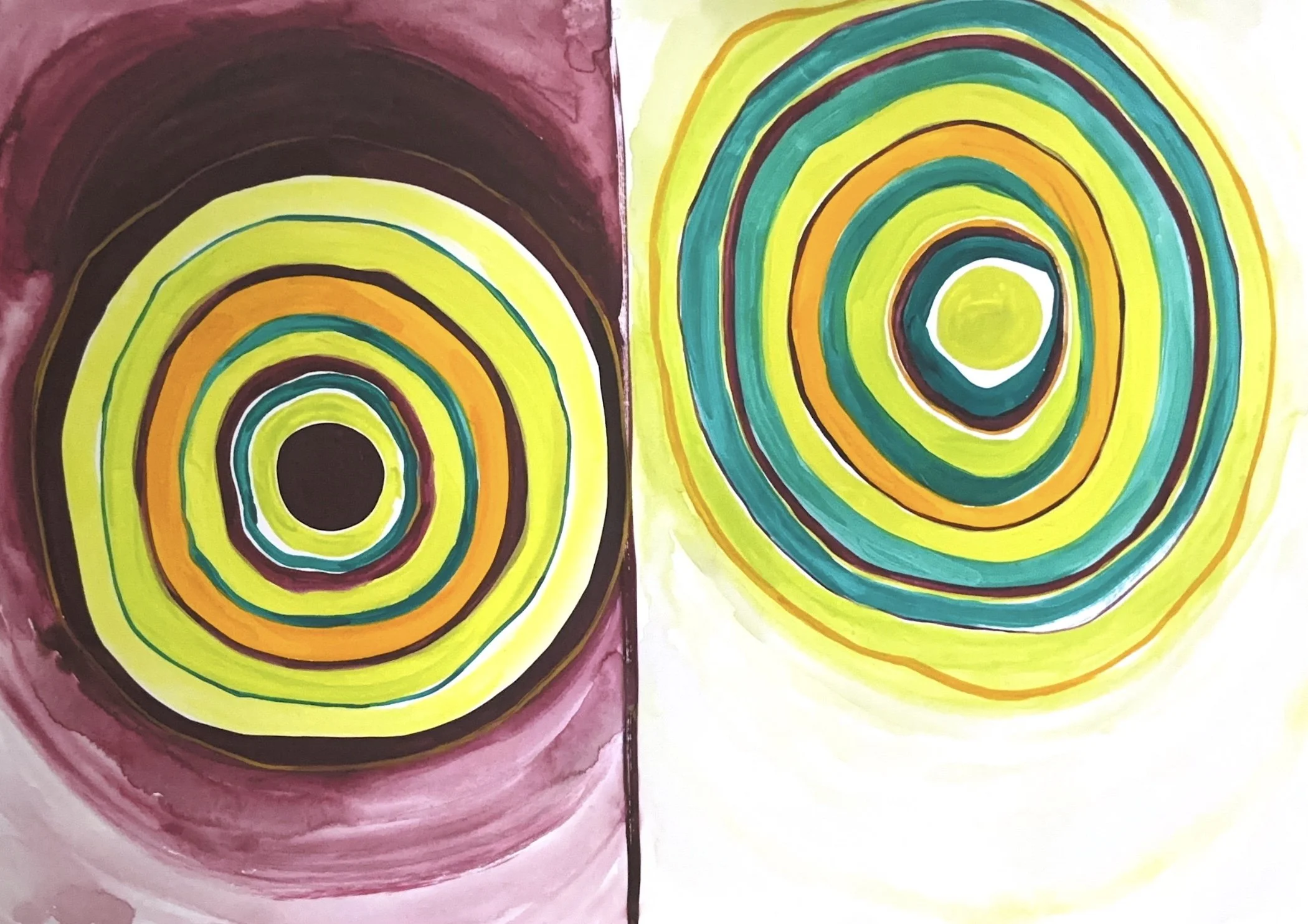Two abstract spiral paintings side by side. The left spiral has a dark purple background with concentric rings in yellow, green, orange, and black, ending in a black center. The right spiral has a light yellow background with concentric rings in green, yellow, orange, and dark green, ending in a yellow center.