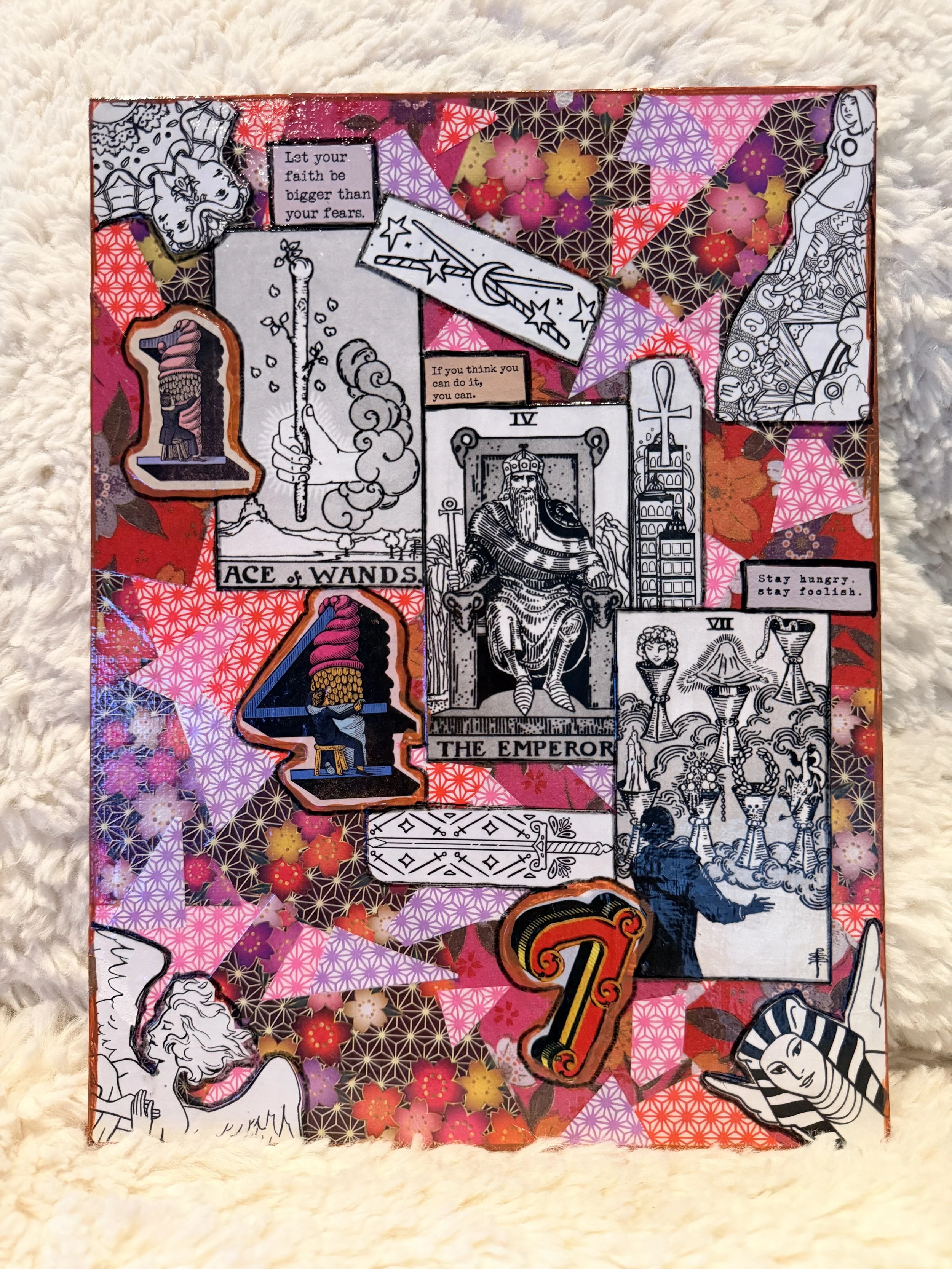 Collage of tarot card illustrations, motivational quotes, and decorative paper patterns, placed on a fluffy surface.