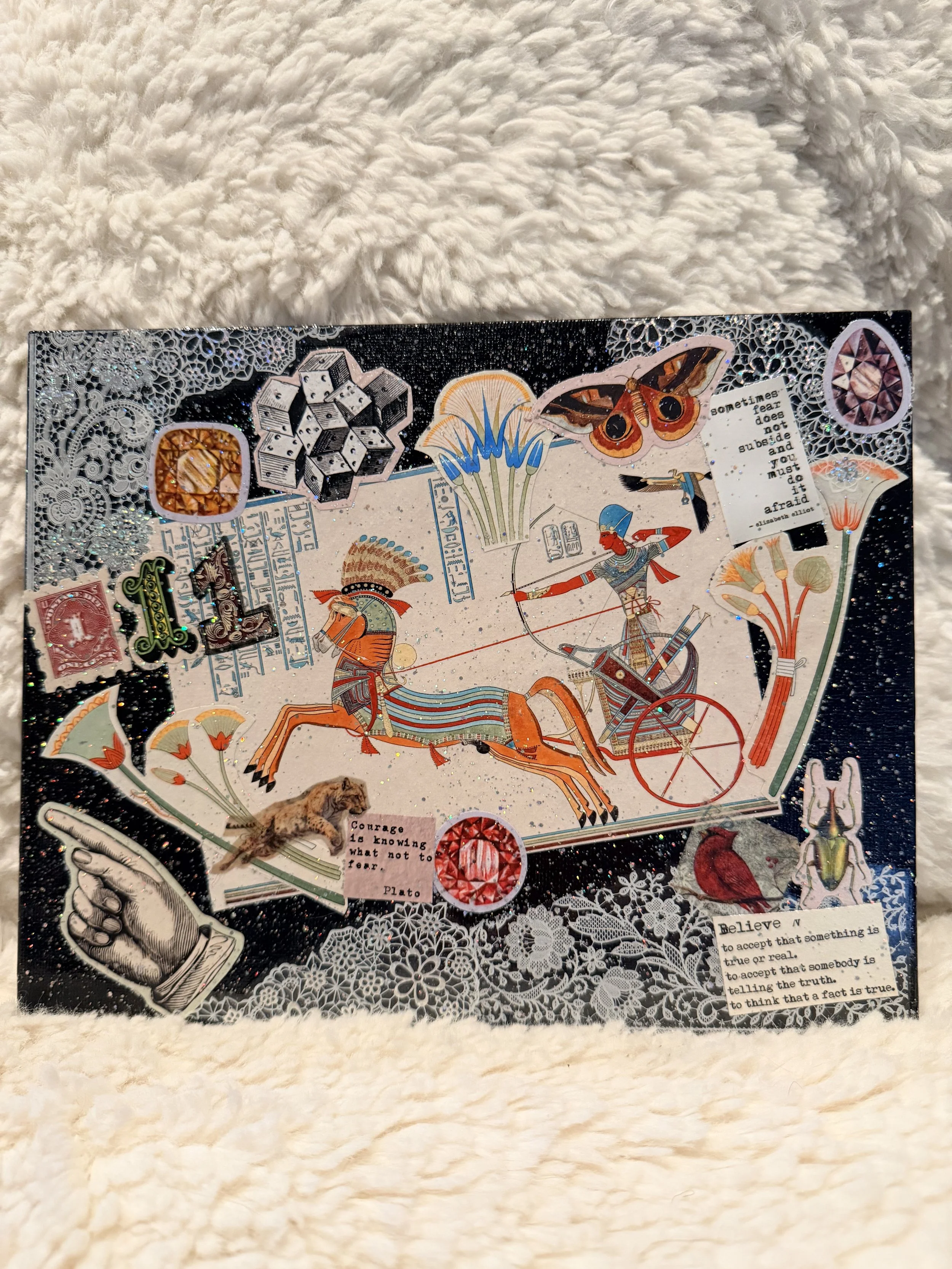 A collage of various artistic and decorative stickers, including a spider web, dice, a butterfly, flowers, quotes, and other intricate designs, all on a sparkly black background.