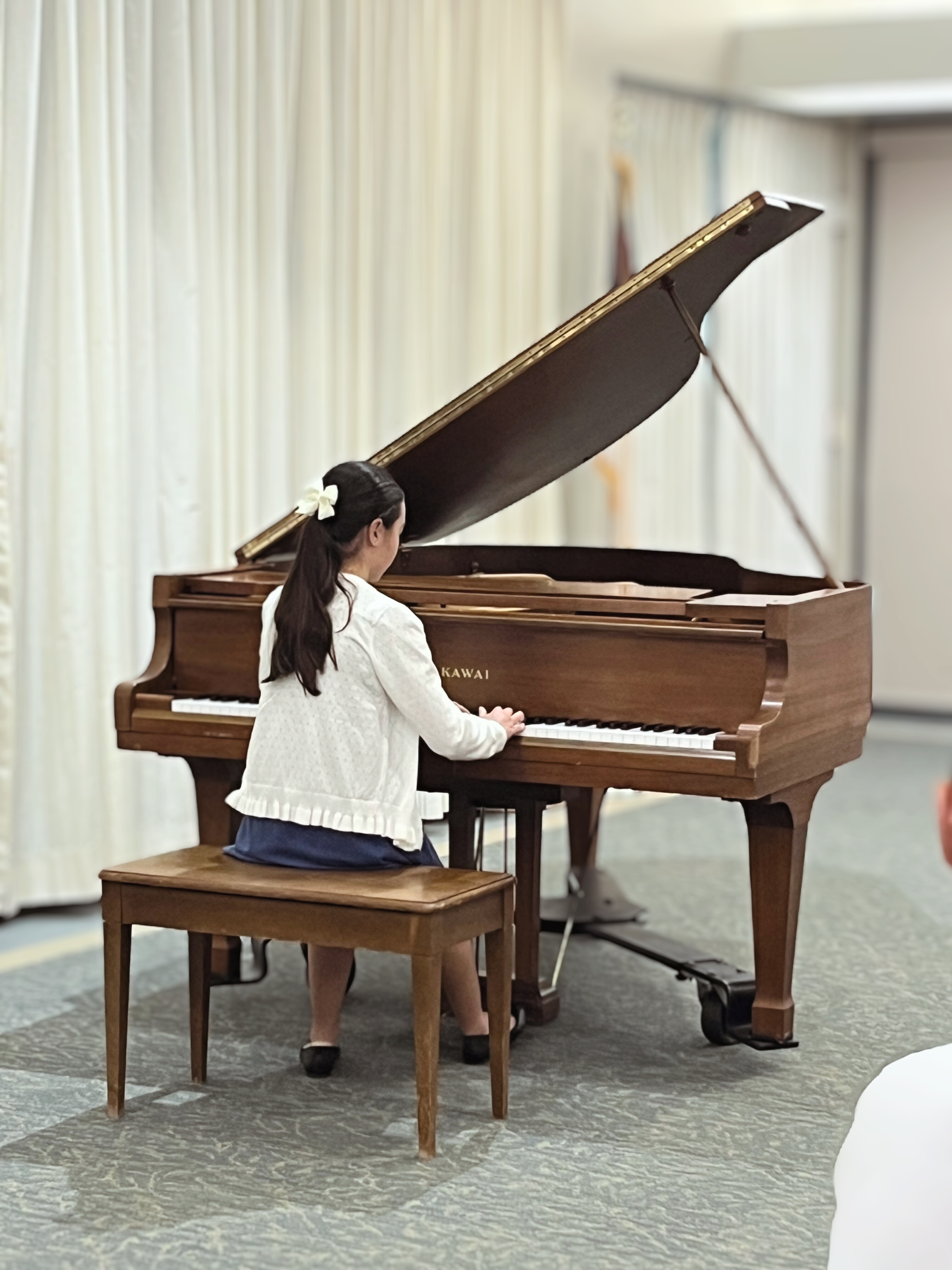 Emily's student performing at a CAPMT district recital