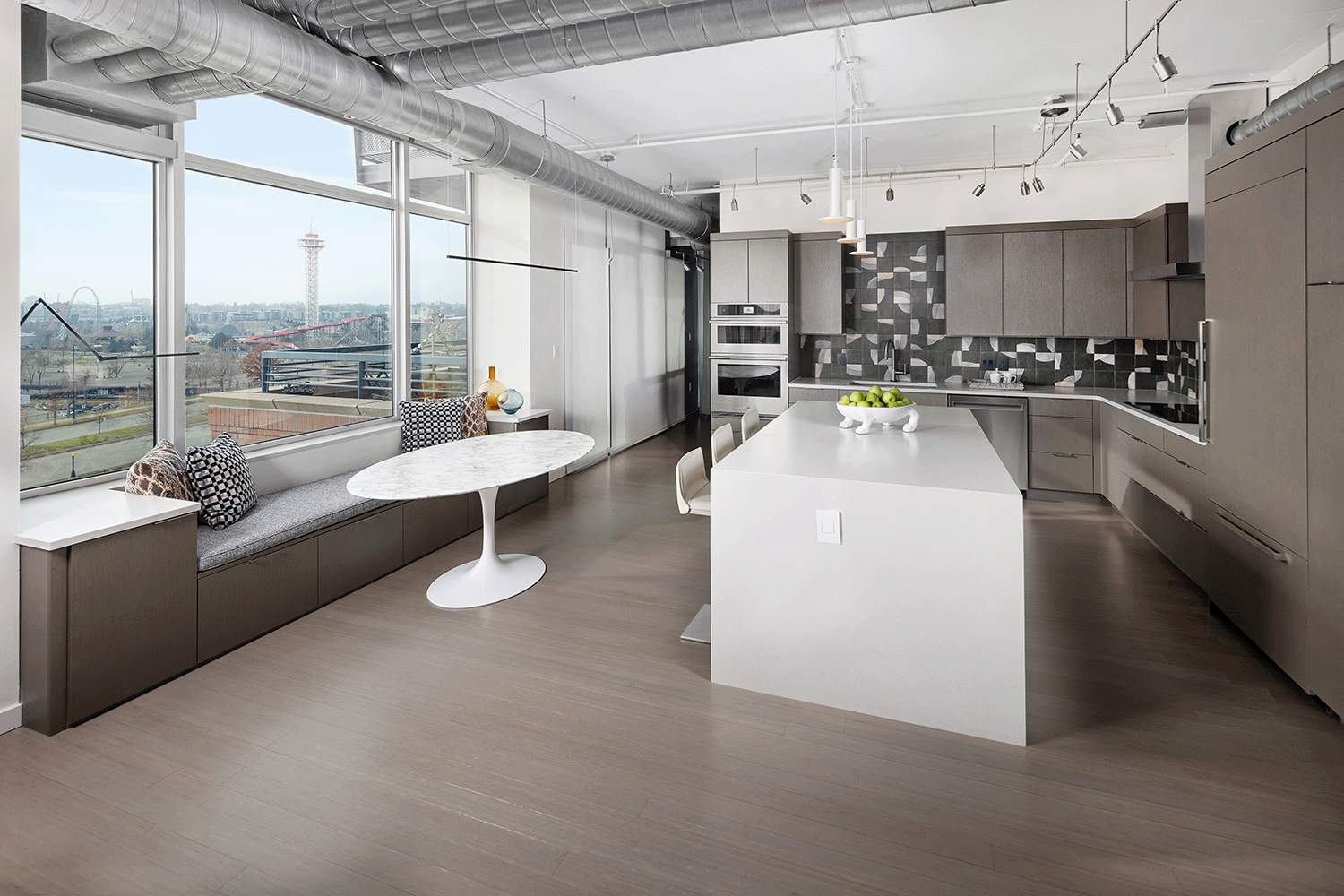 Loft kitchen with custom banquet seating.