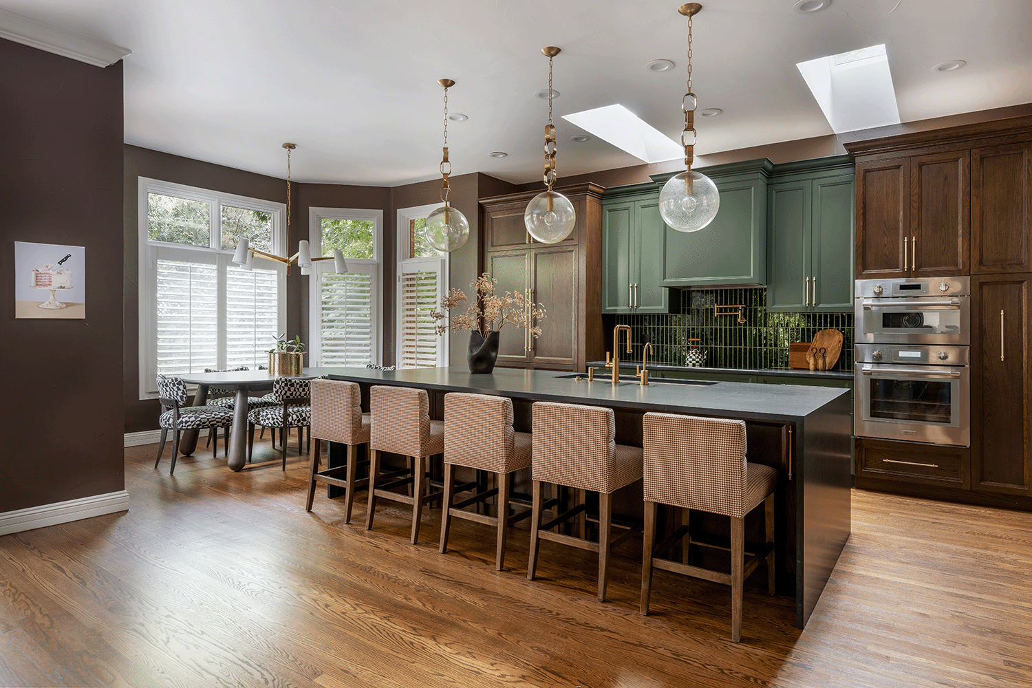 Contemporary kitchen featuring green tiled backsplash, large island, 