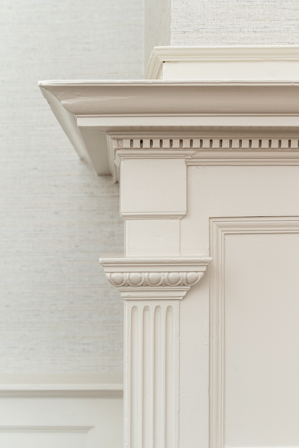 Detailed millwork fireplace surround.