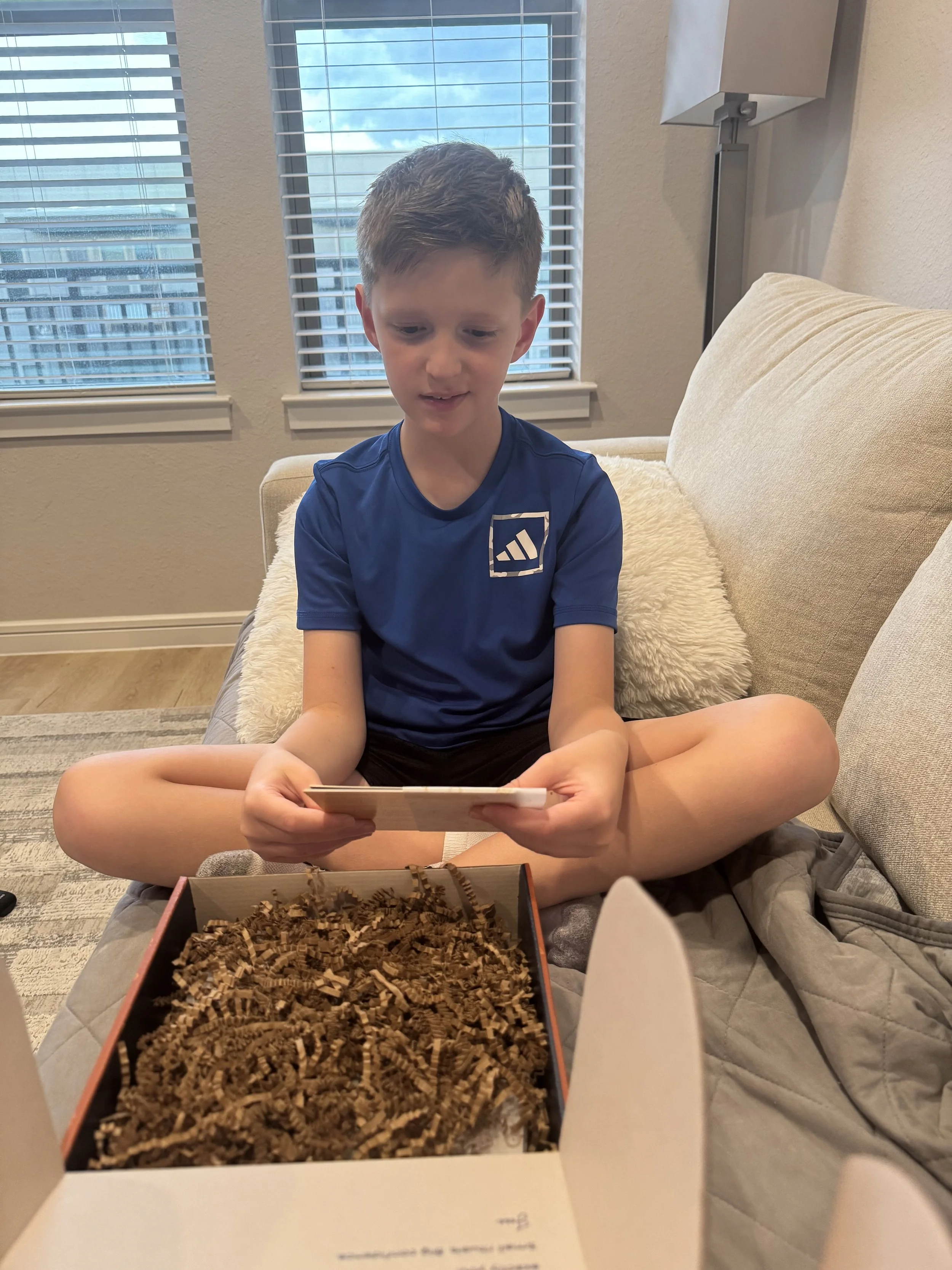 Boy opening Milk and Coffee Kids Kit