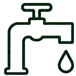 Green faucet dripping water into a gray sink after we install our water system.