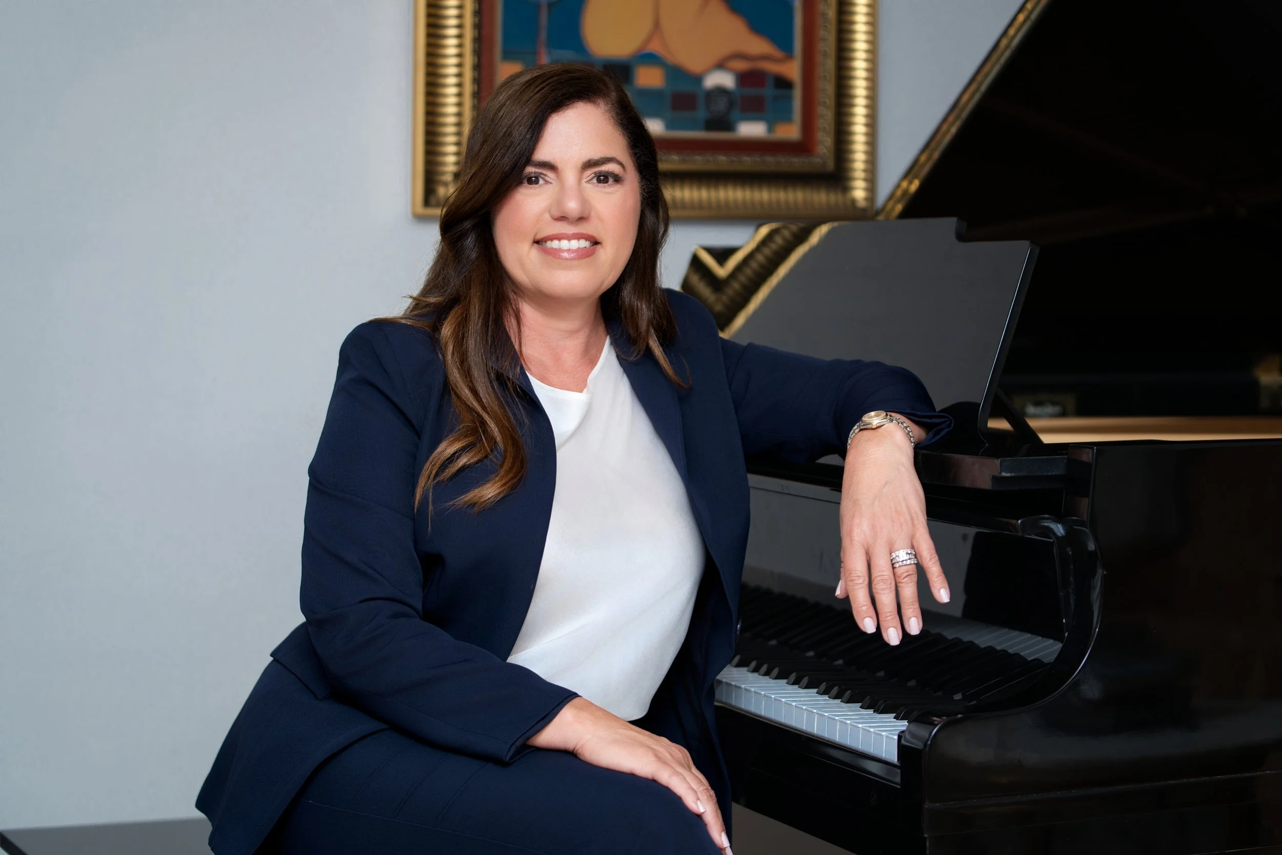 Portrait of President Karen S. Veloz at the piano.