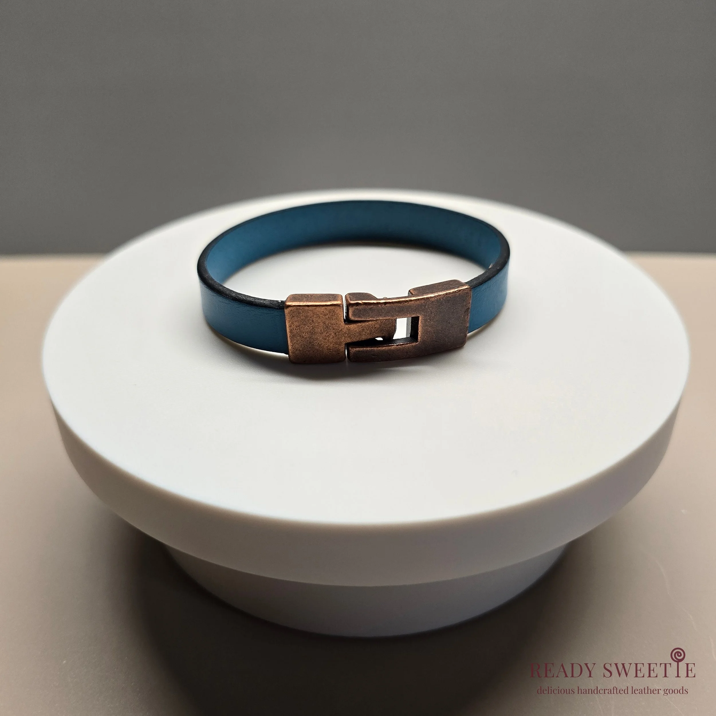 Teal blue single with copper clasp.jpg