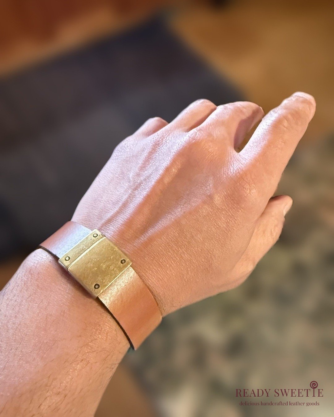 Natural_leather_antique_brass_blurred_4x5_on_wrist watermark.jpg
