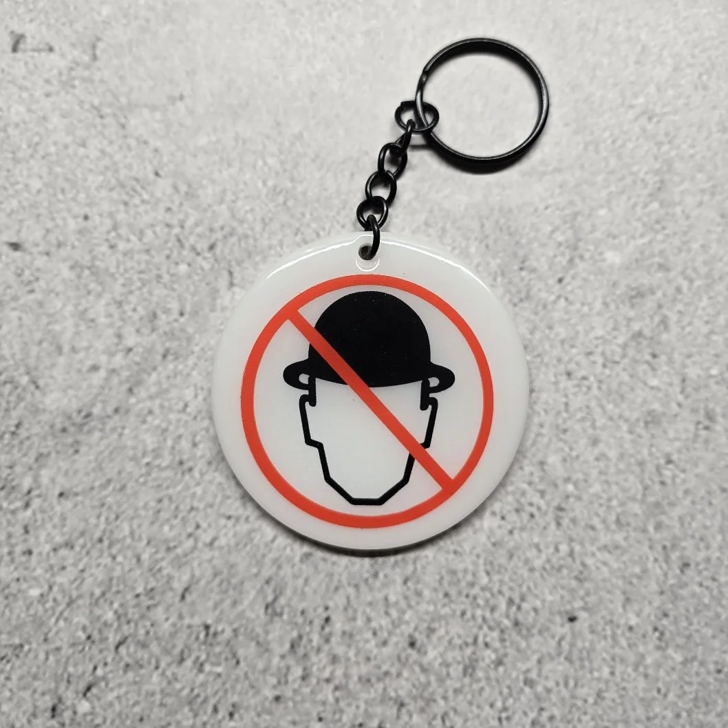White acrylic MWH  logo keychain