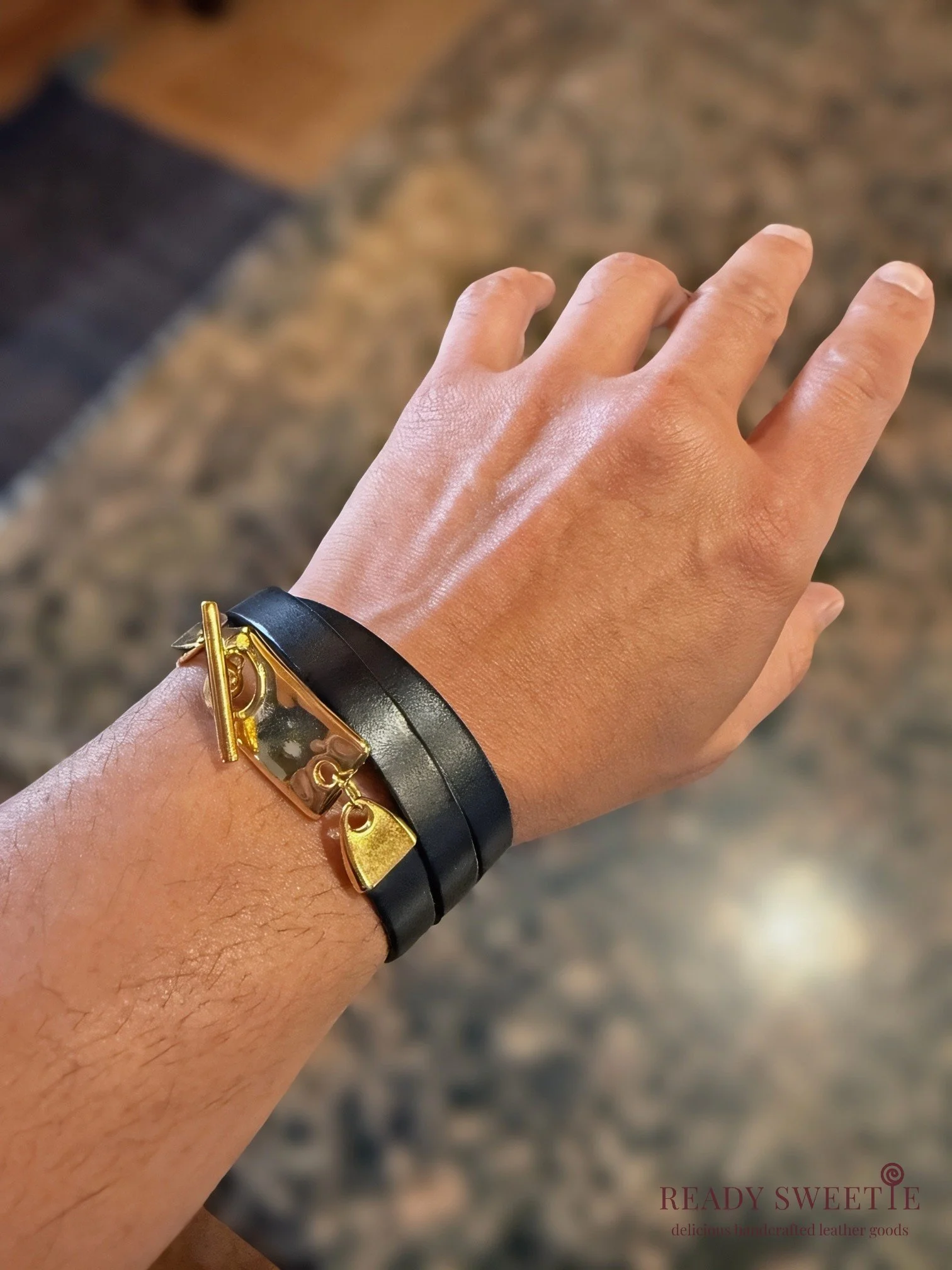 Black leather gold toggle triple wrap on wrist with watermark.jpg