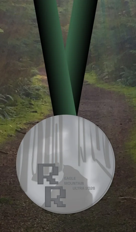 Race medal mockup with a forest trail background, featuring a mountain design and the text 'Eagle Mountain Ultra 2026'.