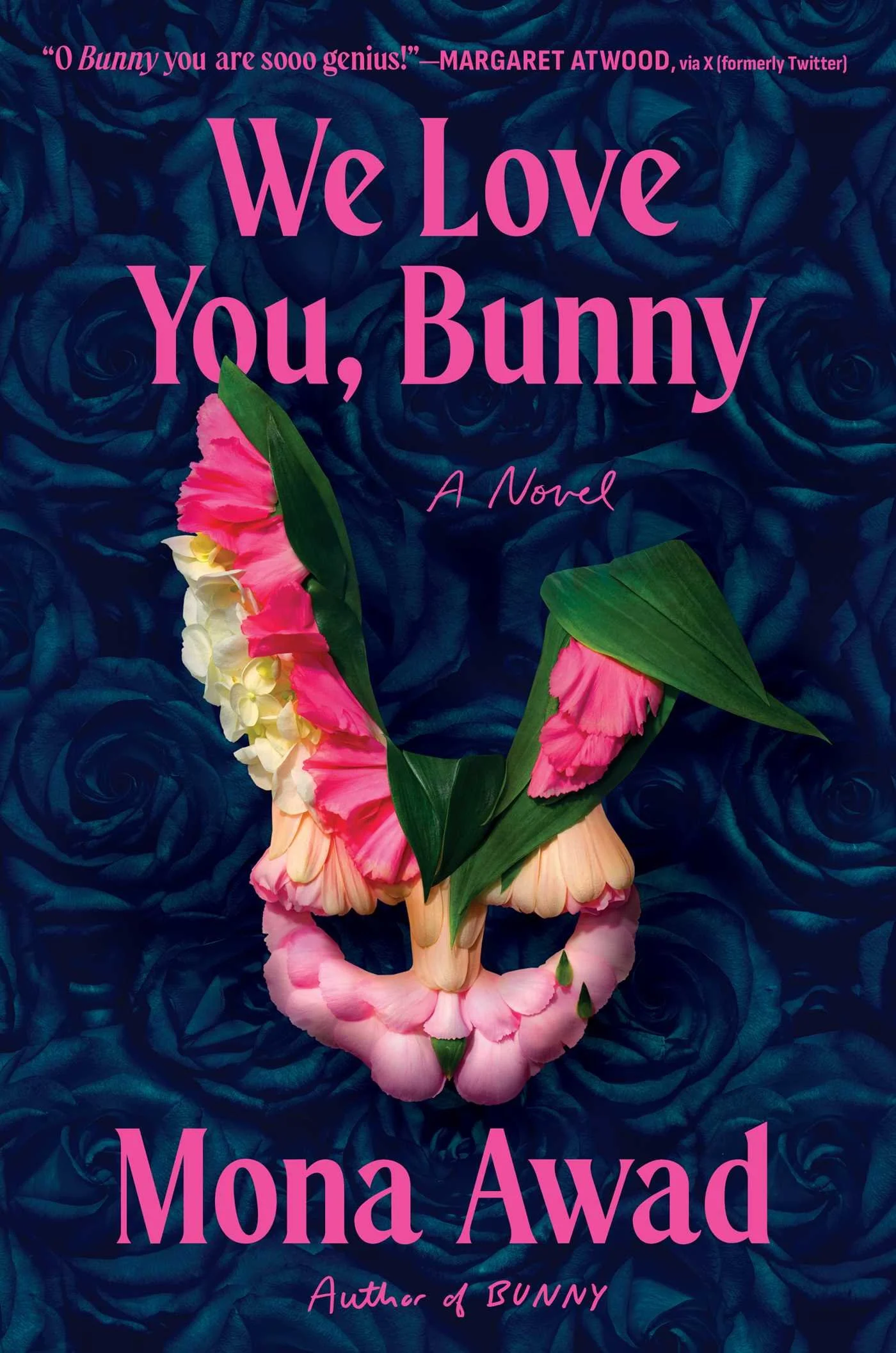 Book cover with a dark blue background containing a pattern of roses, pink text that reads "We Love You, Bunny," with a floral arrangement of pink and white flowers and green leaves at the bottom, and additional text indicating the author Mona Awad.