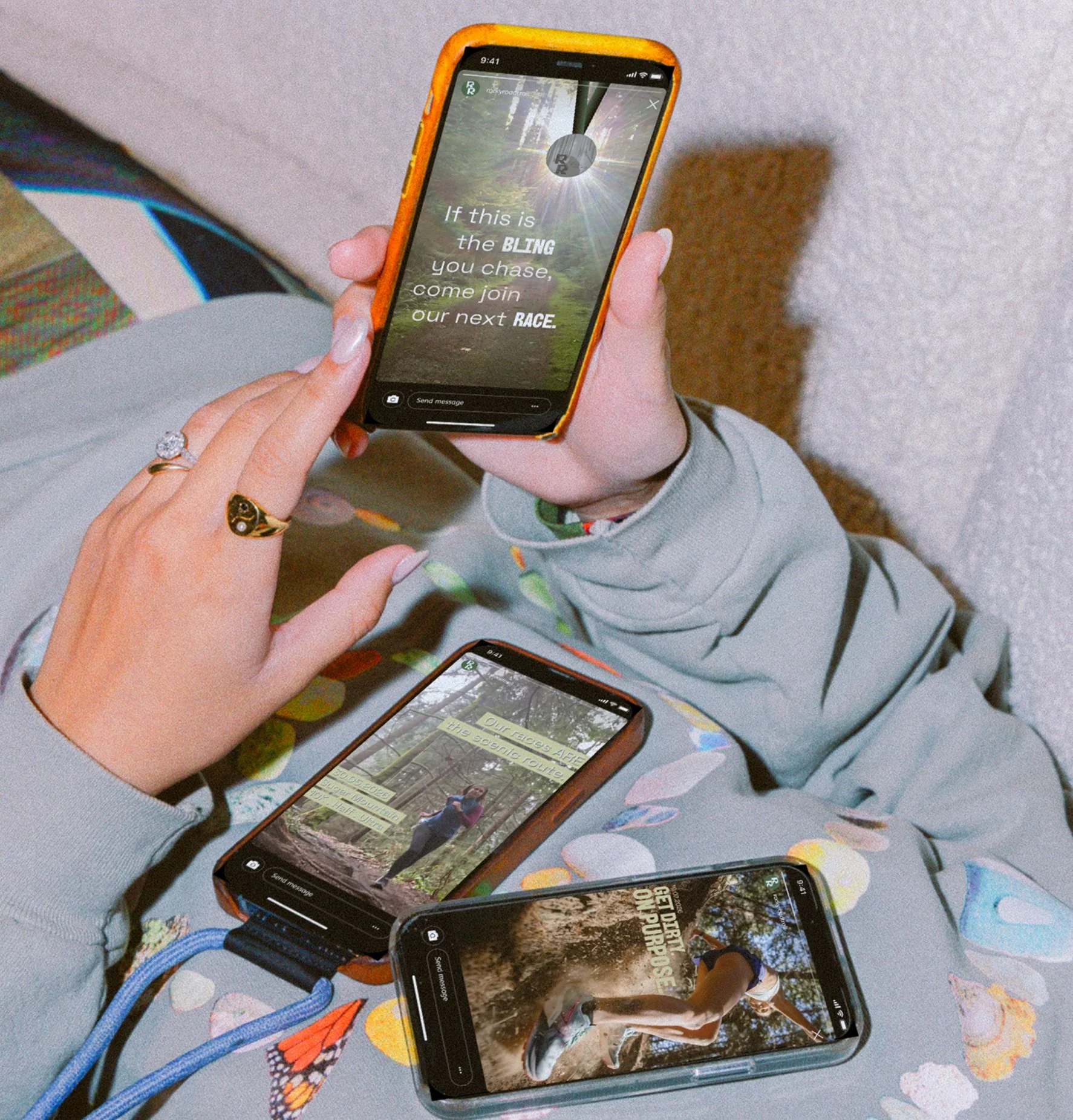 iPhone mockups: 3 phones displaying Instagram stories for Rocky Road Trail races; one phone is held in a person's hands and the other two rest on the person's chest.