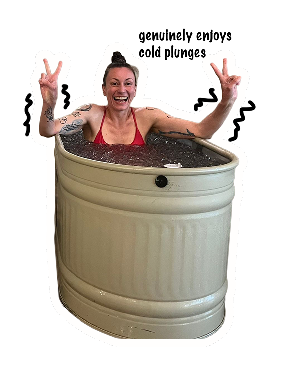 Lisa smiling and making peace signs while sitting in an ice bath or cold plunge.