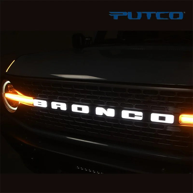 Front of a black car with illuminated 'BONGO' badge on the grille and a blue 'PUTCO' decal on the hood.