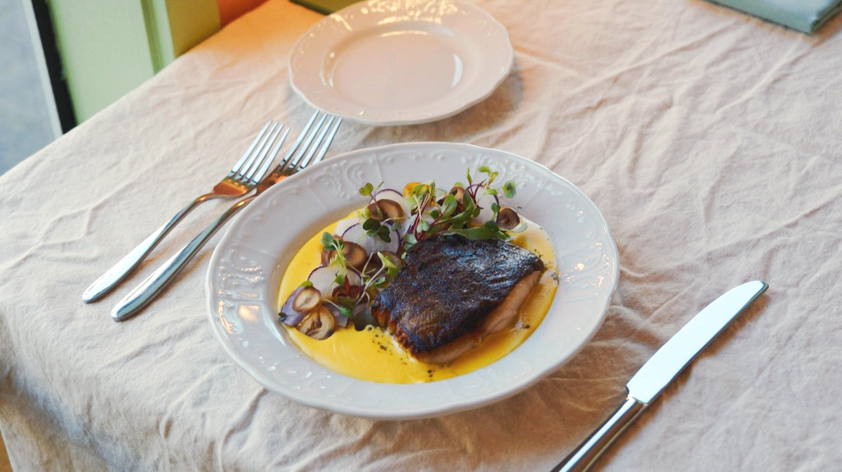Fall flavors shine with a salmon dish featuring local squash puree. A balance of flavors showcase the chef-driven menu.