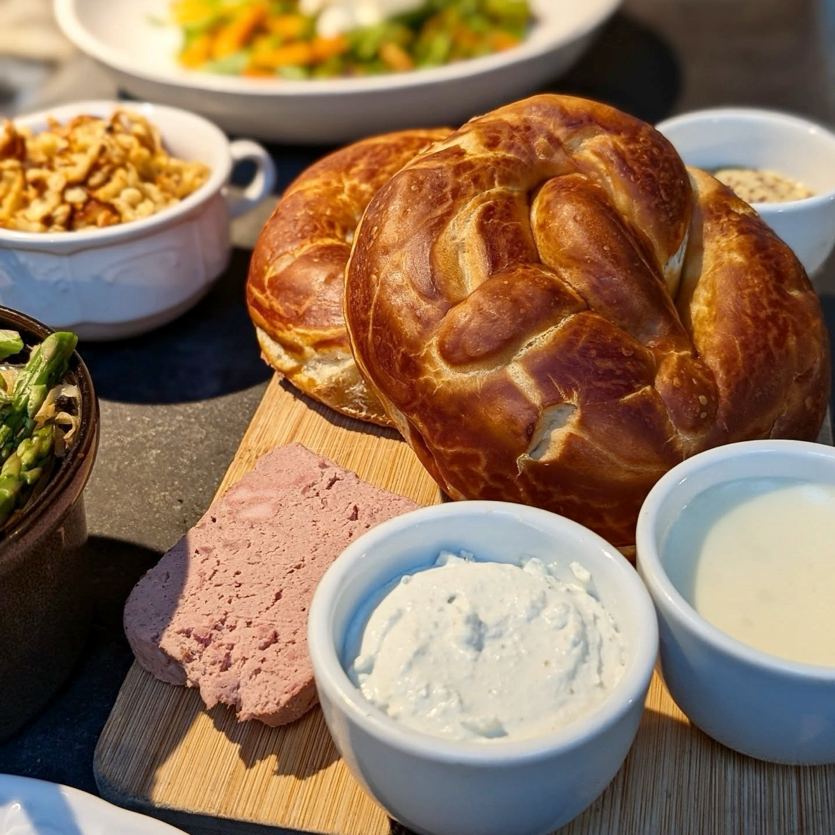 Daily made soft pretzels in the authentic German style are a staple of Alsace and at Nous. Cooked daily in our wood fired oven and served with pate, mustard, and jam.