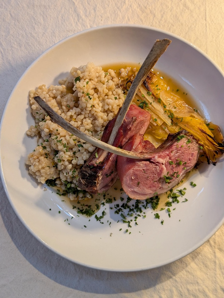 Anderson Valley Farms Lamb Chops atop cous cous is the definition of upscale comfort food. A celebration of flavor.