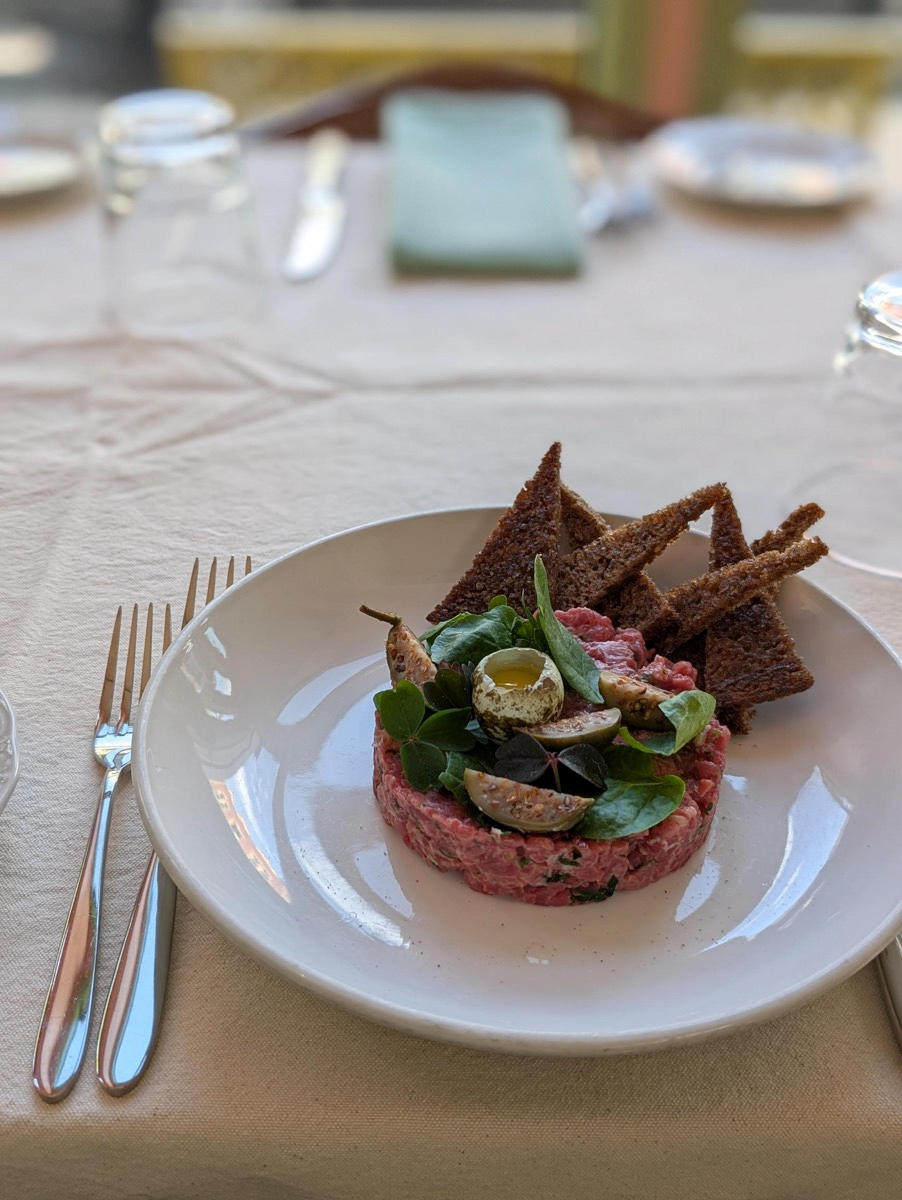Fresh Beef Tartare, an Alsatian staple, paired with gluten free bread and a quail egg. Fresh flavors but also dairy free.