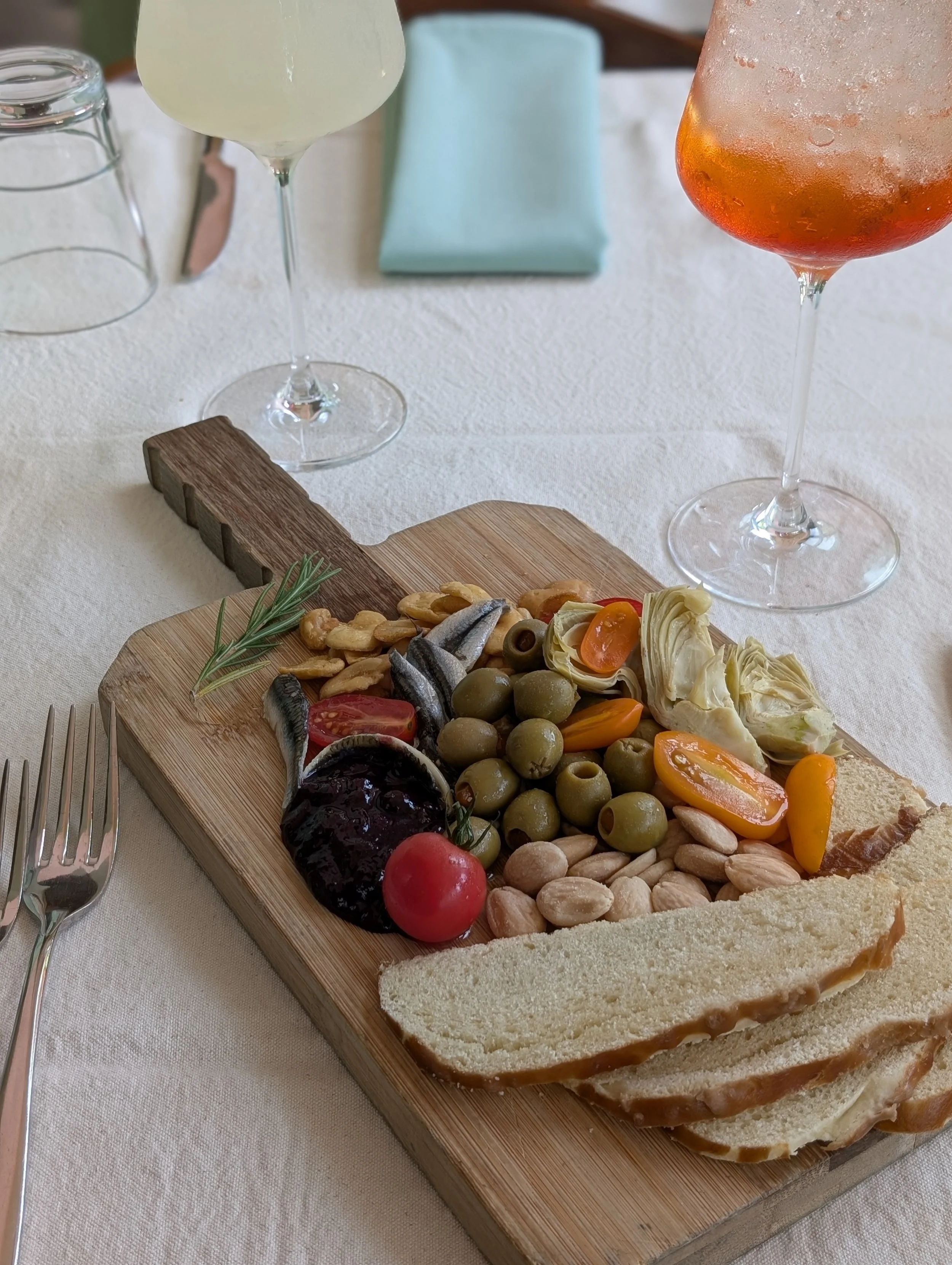 Happy hour is Apero hour at Nous. A European tradition of enjoying spritzes al fresco on the patio and munching on tinned fish and olives.