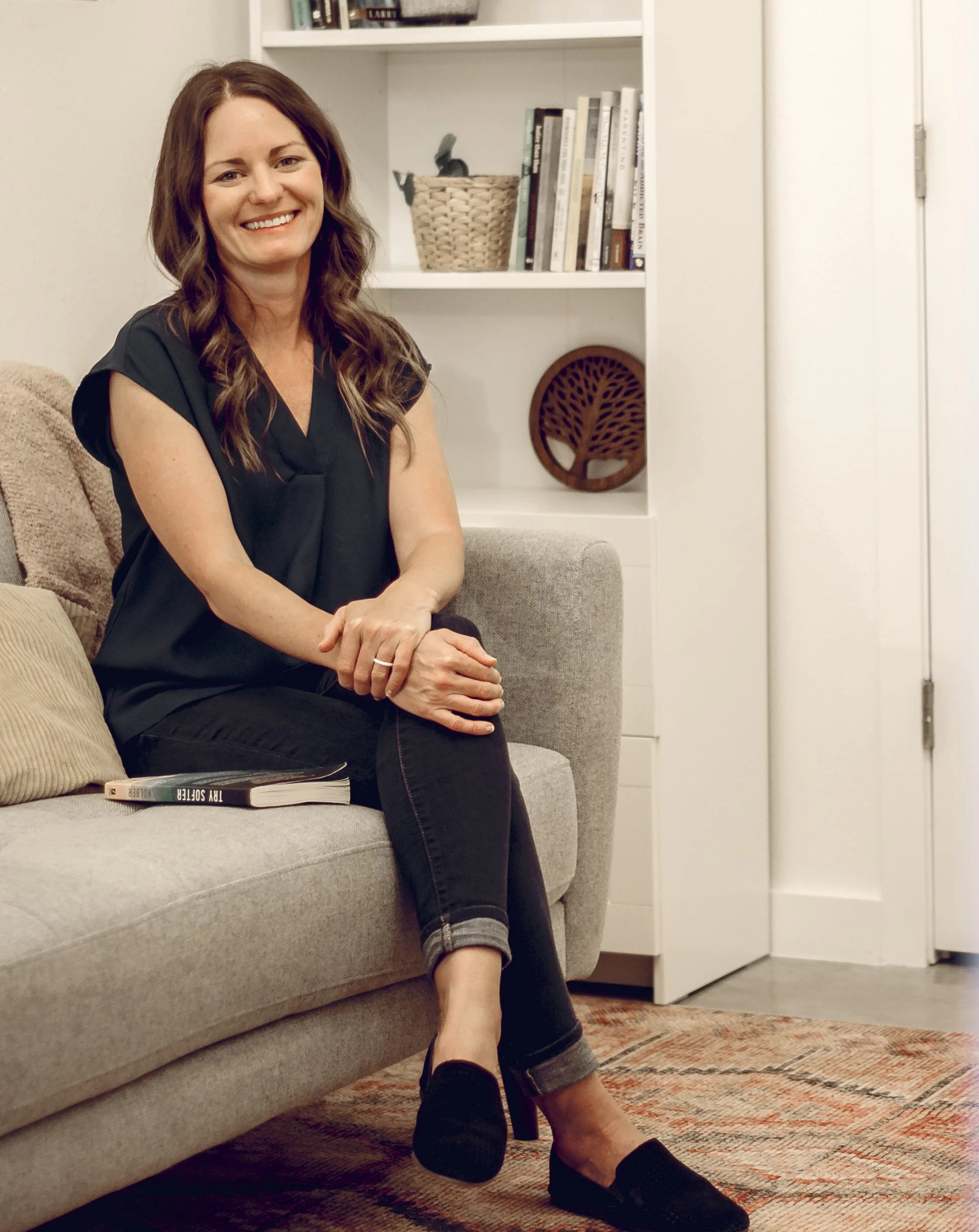picture of Lee Anne Bingham sitting on couch, counseling office in San Antonio, Texas