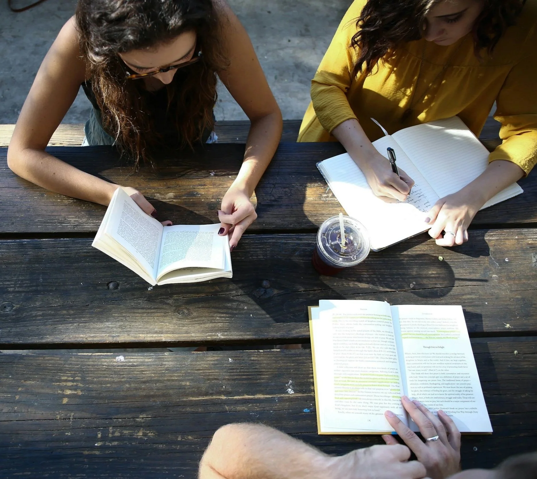 3 girls reading at table, enneagram coaching