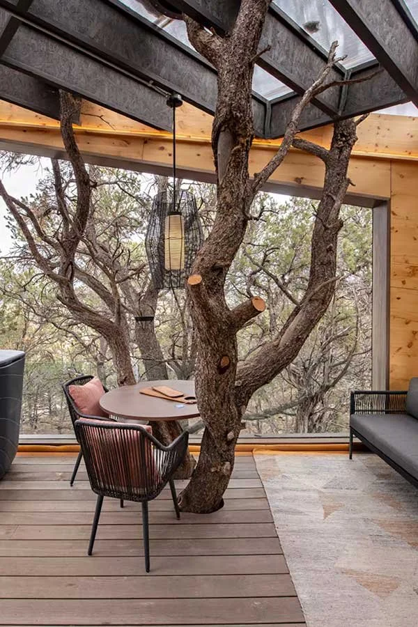 Inviting seating area inside a unique mountain treehouse getaway