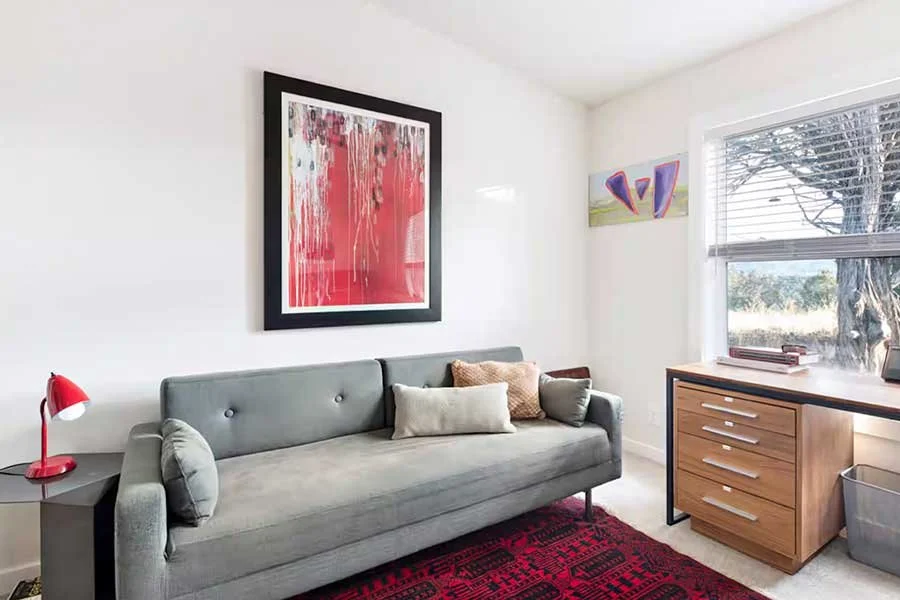 Modern mountain living room with comfortable furnishings and expansive windows at High West House