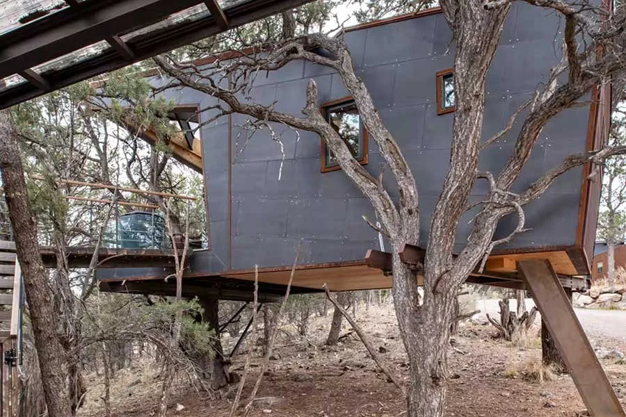 Elevated Colorado treehouse surrounded by natural mountain scenery