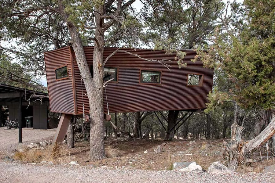 Elevated Colorado treehouse surrounded by natural mountain scenery