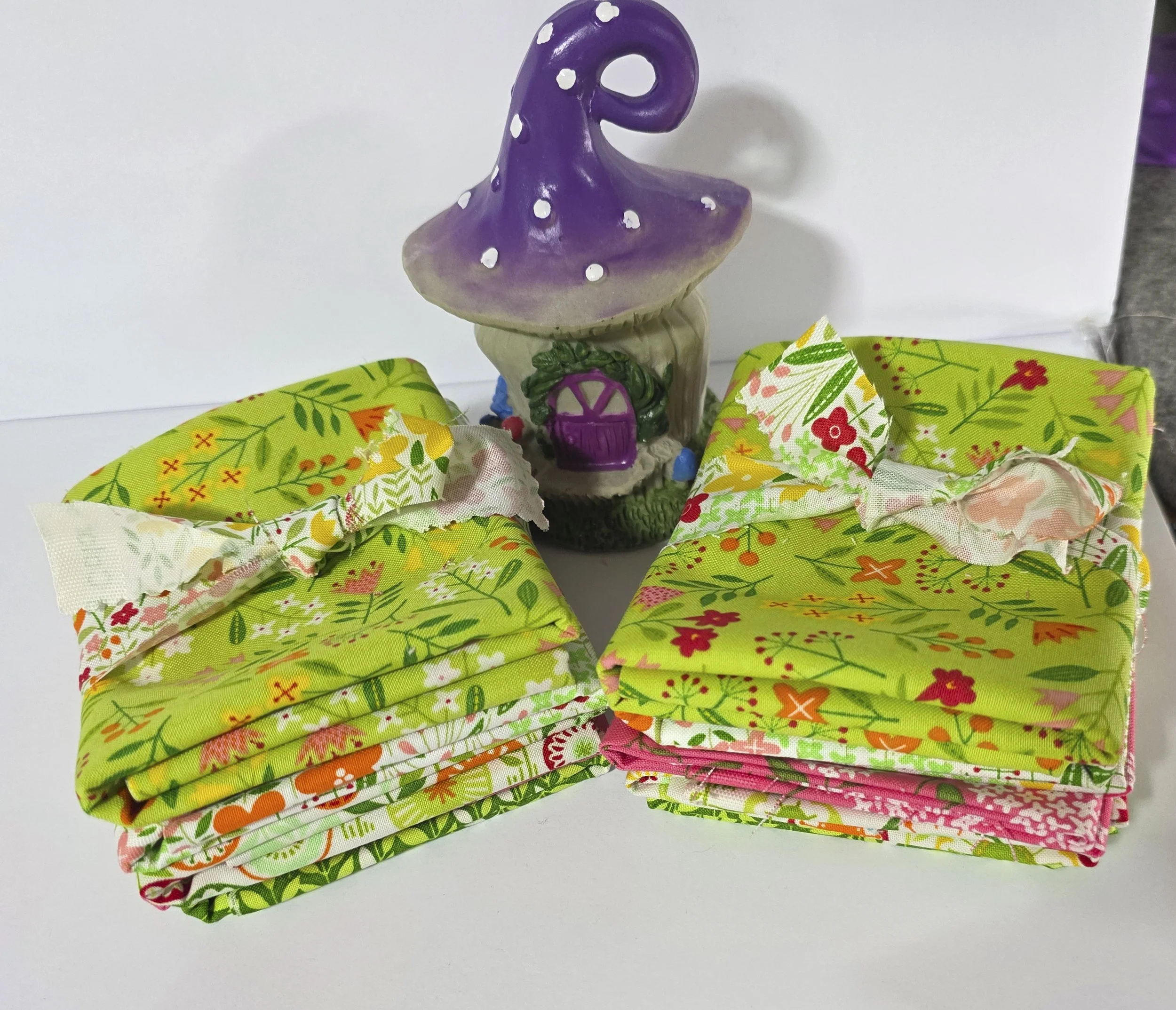 Two fabric bundles with mushroom house.jpg