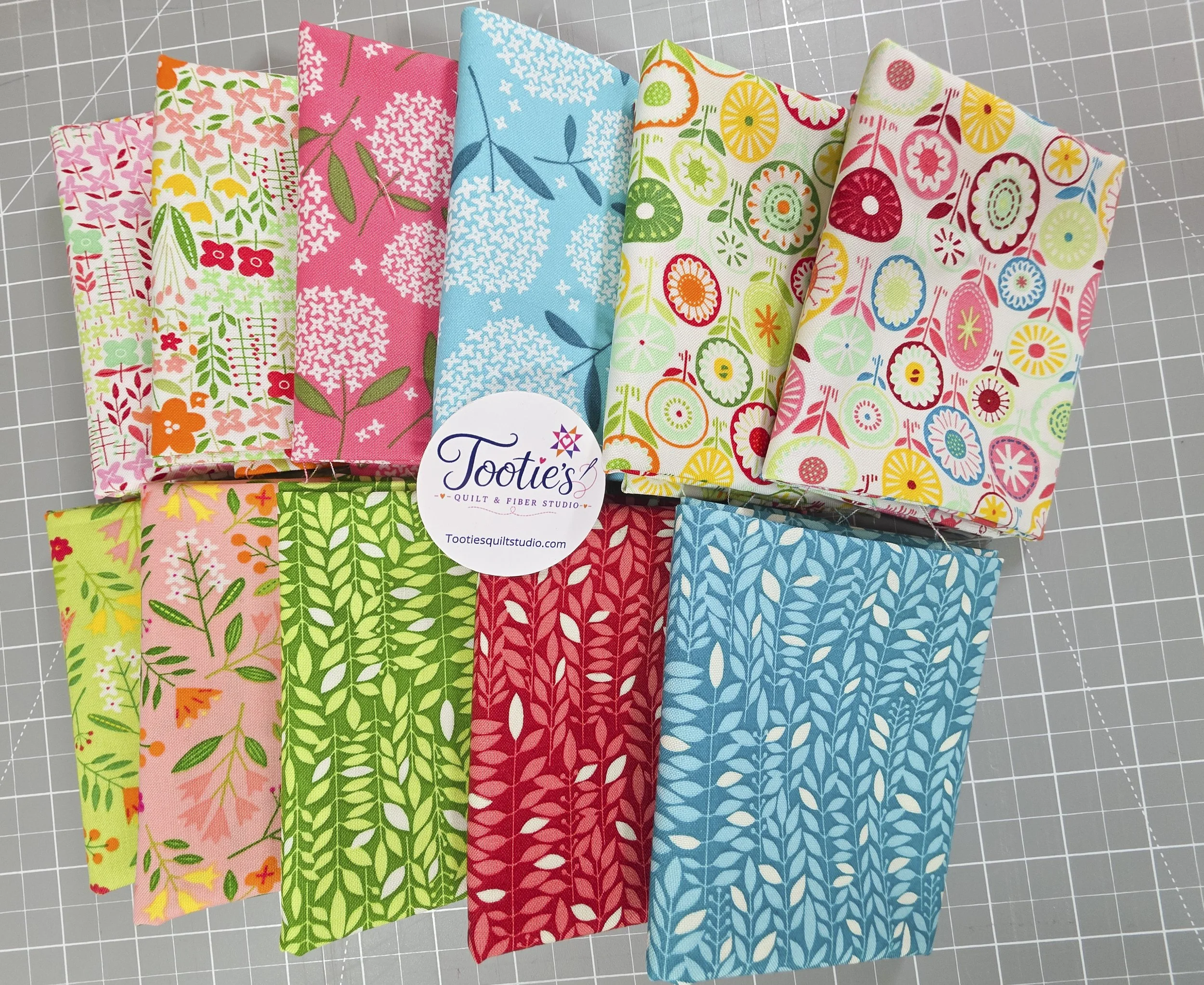 11 pc Blooming Clr fabric bundle flat with Tootie Sticker.jpg