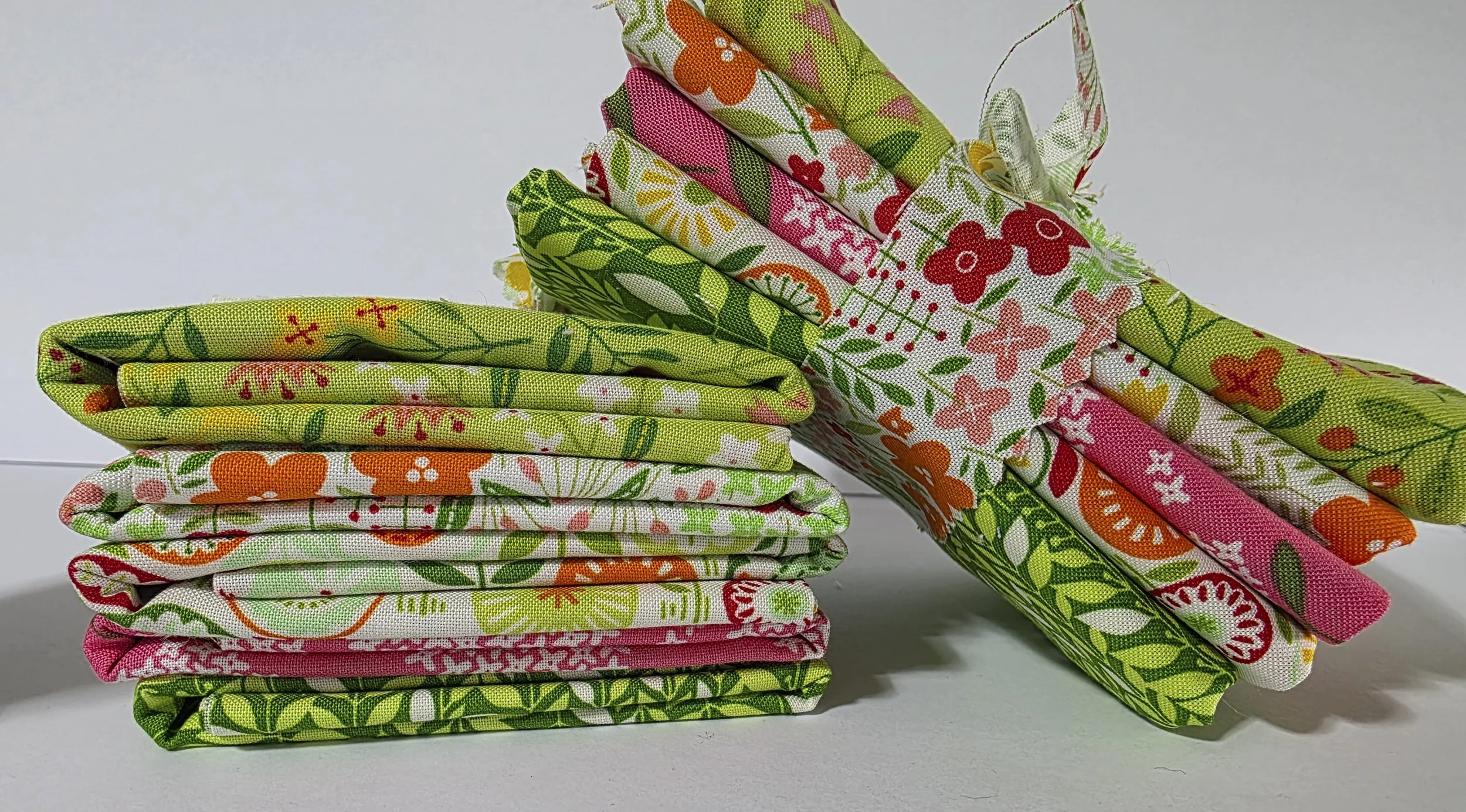 Two fabric bundles with one leaning on the other.jpg