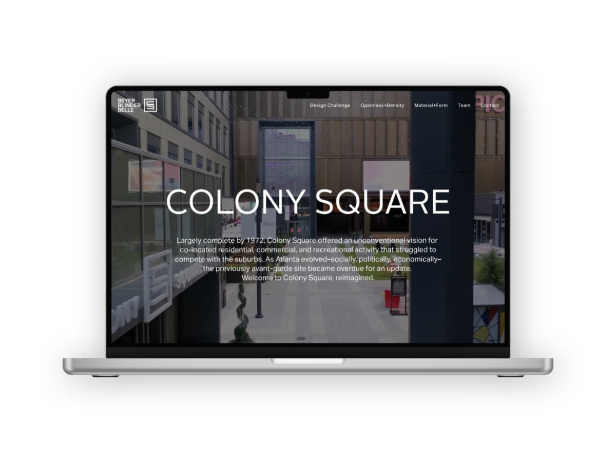 A laptop displaying a webpage about Colony Square, an urban development project in Atlanta, with modern architecture and an outdoor plaza.