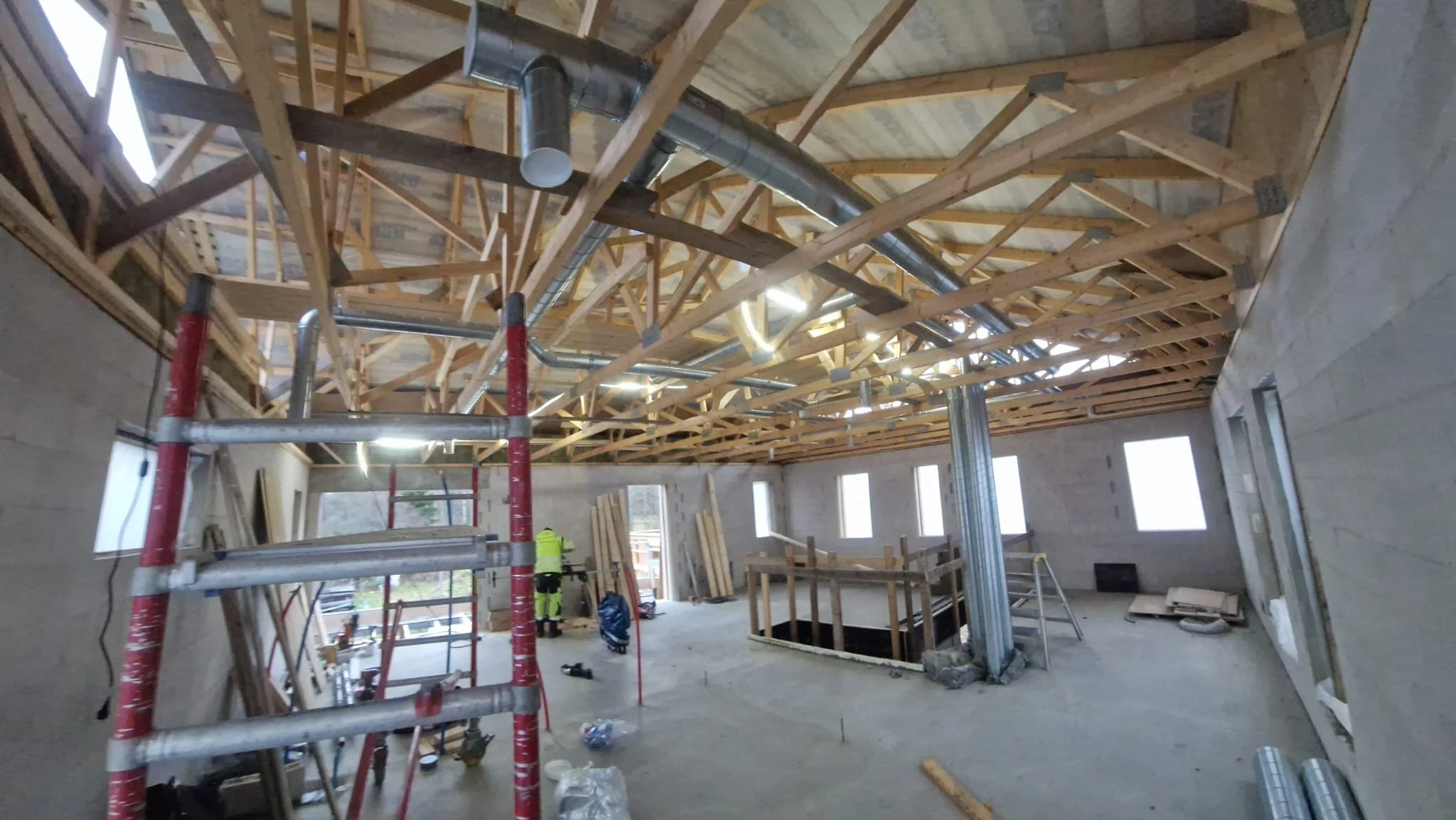 Oranssi technician working on a roof project