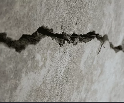 Close-up of a crack in a concrete wall.