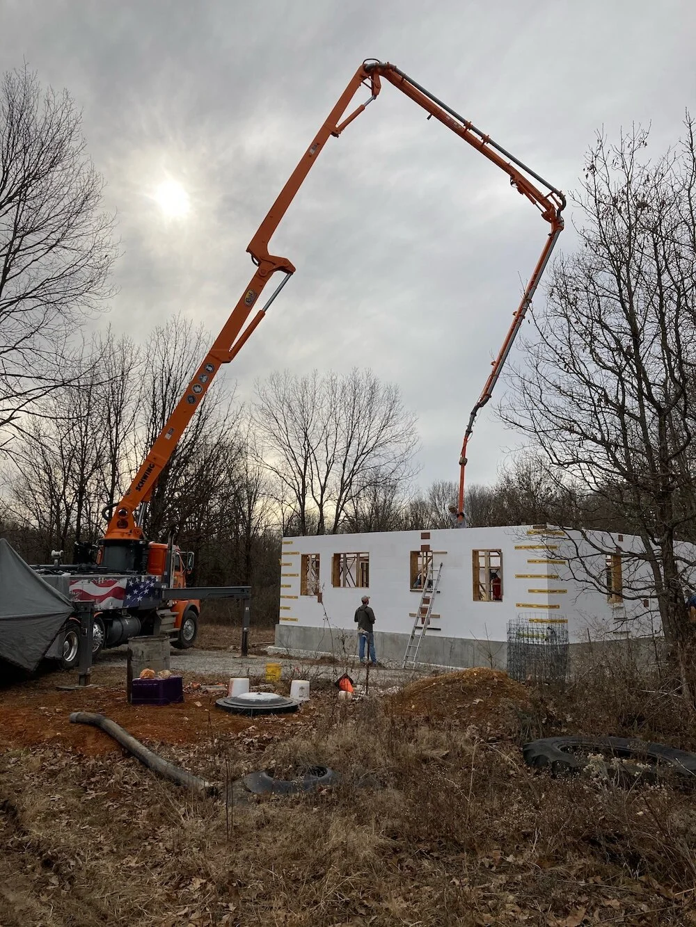 Pouring concrete into our walls!