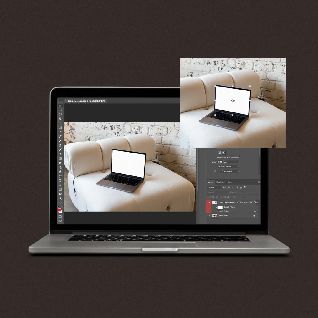 A laptop sits on a dark surface with a photo of a sofa and a laptop overlaid, making it appear as if the laptop has a larger screen showing the sofa and a smaller screen showing the laptop with a white background.