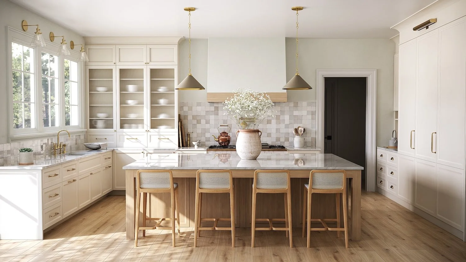Bright kitchen with white cabinets, a large central island with a white marble countertop, four beige chairs, large windows, and minimal decor. A vase with flowers is on the island, and there's a tile backsplash behind the stove.
