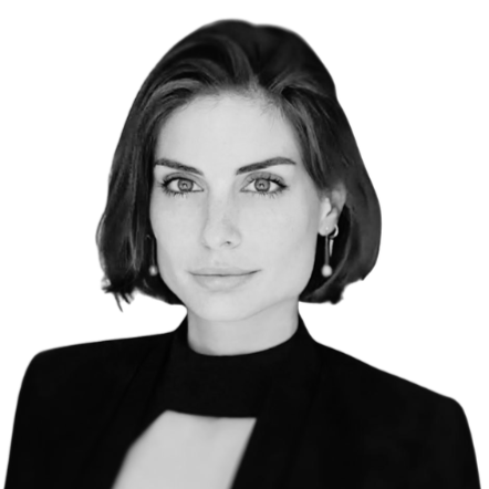 Black-and-white portrait of a woman with short dark hair, wearing a black top and dangling earrings.
