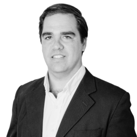 Black and white portrait of a man in a suit and white shirt