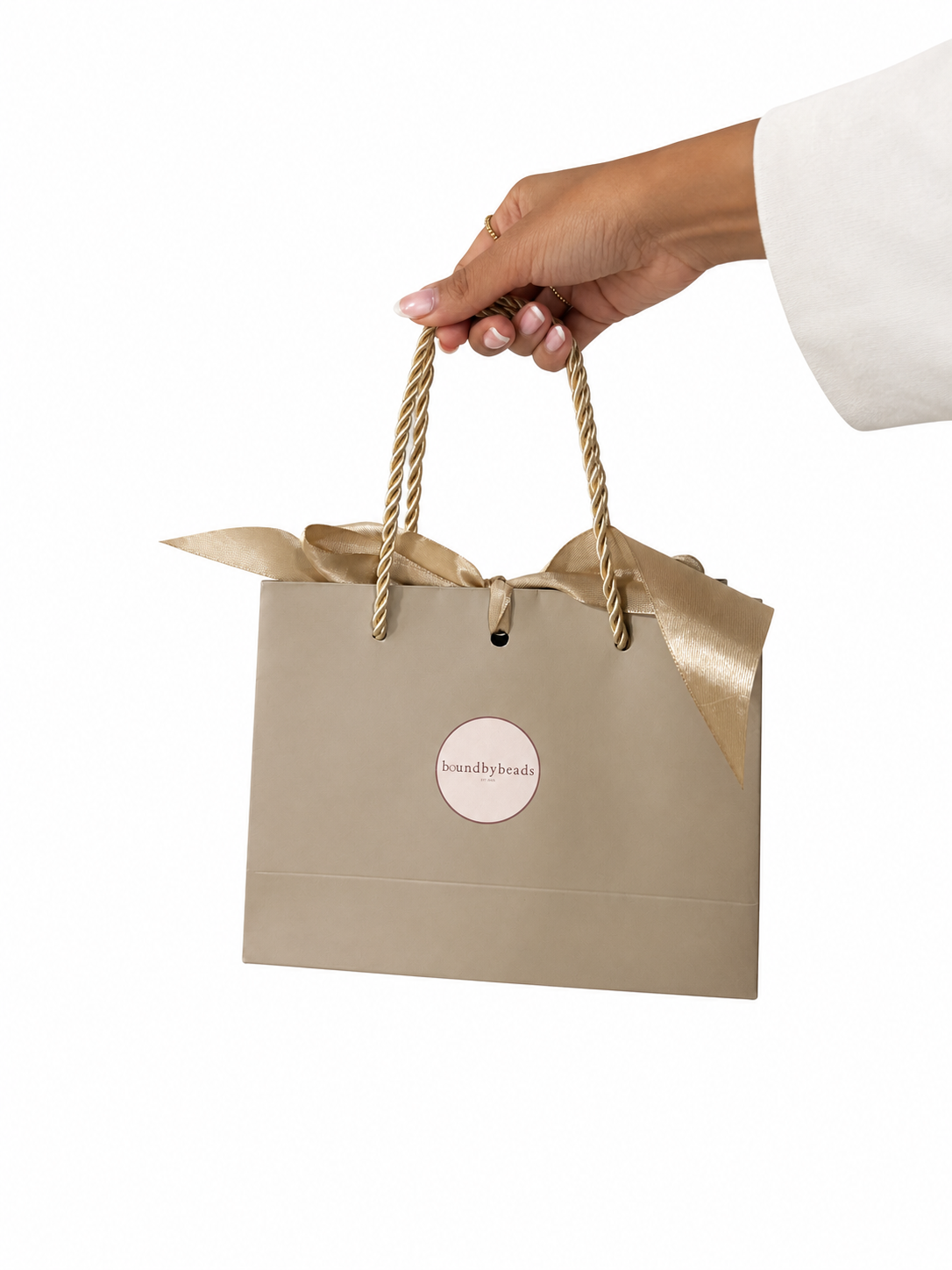 Elegant Taupe Gift Bag with Gold Ribbon.png