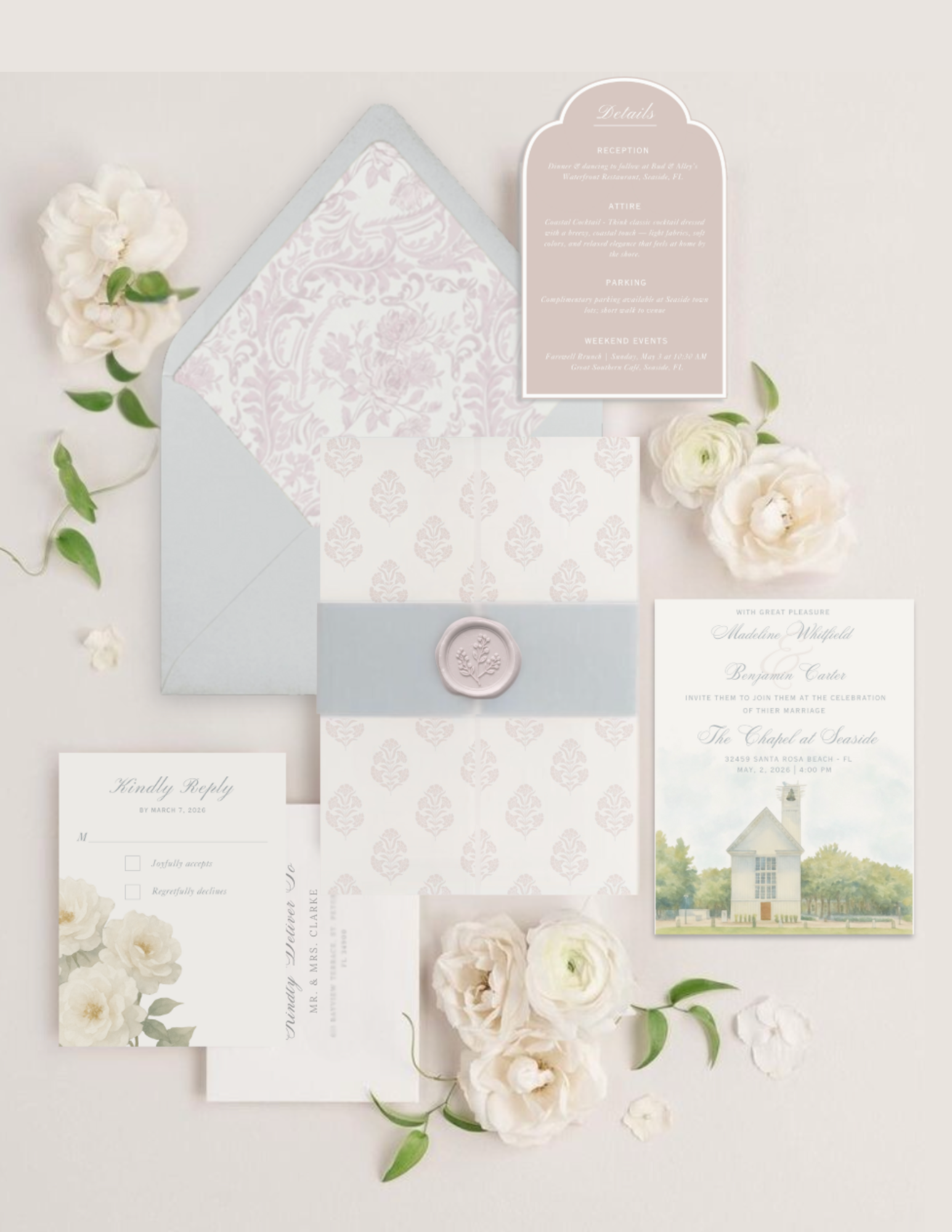 A wedding invitation set with ivory and pink theme, including an envelope, RSVP card, and details card, decorated with white flowers and green leaves on a white background.