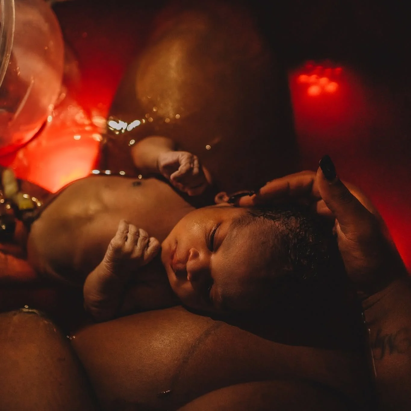 woman skin to skin with newborn