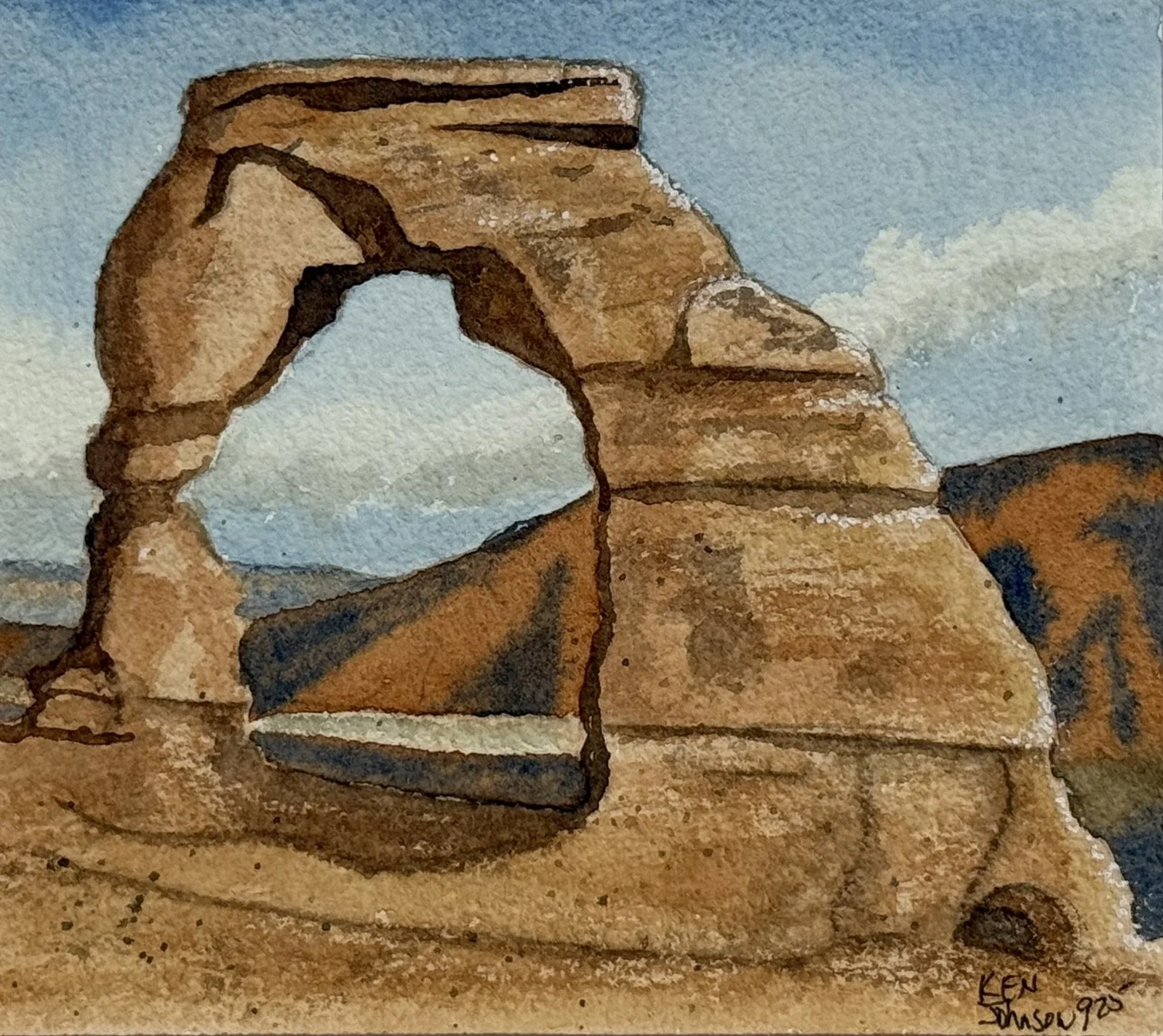 Watercolor painting of a desert landscape with rock formations and a cloudy sky.
