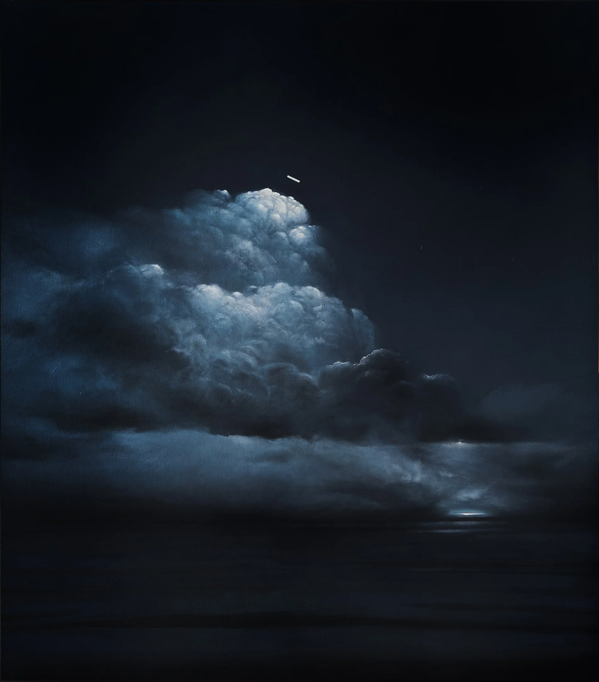 Nighttime sky view showing dark clouds in the lower part of the image and a clear, dark sky above with a small, bright, streak-like object in the upper middle of the sky.