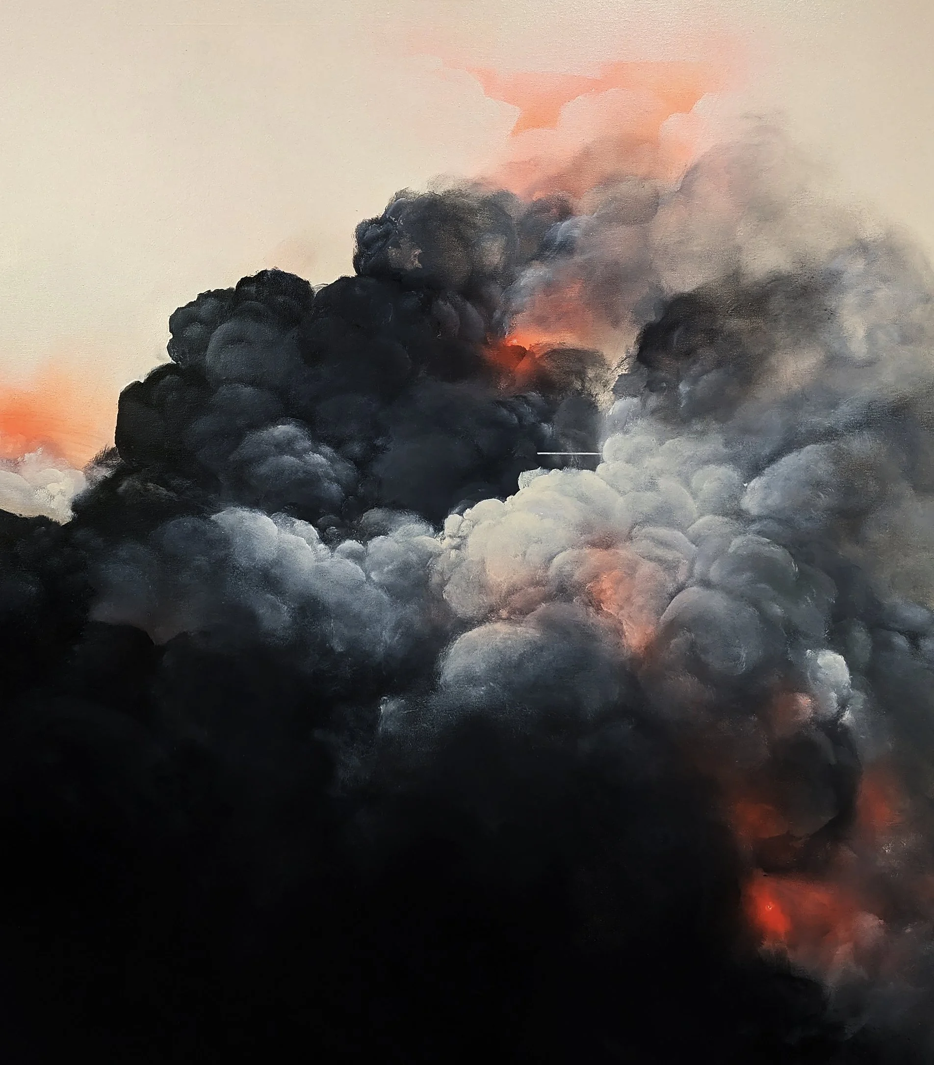Thick black smoke billowing into the sky during daylight with a faint orange glow visible behind the smoke.