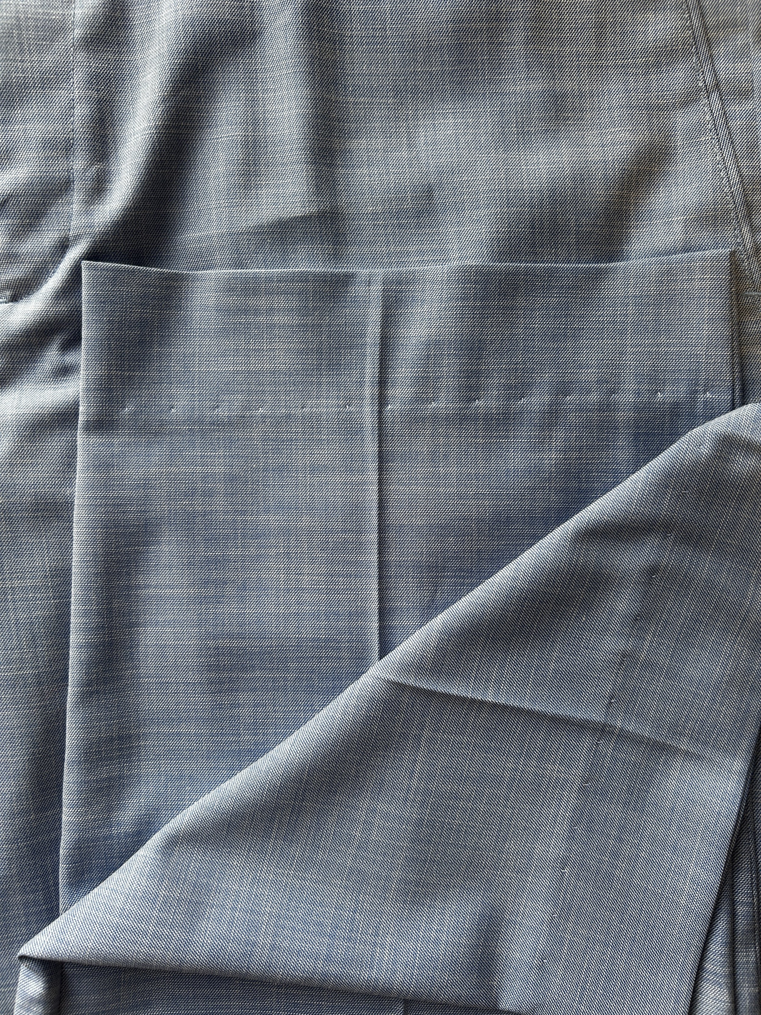 blind hem on light blue trousers