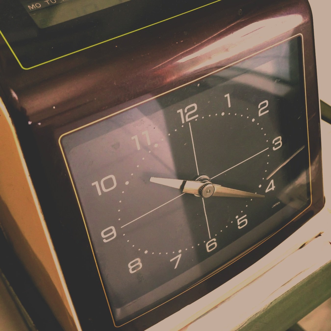 A vintage analog clock showing the time as 10:20.