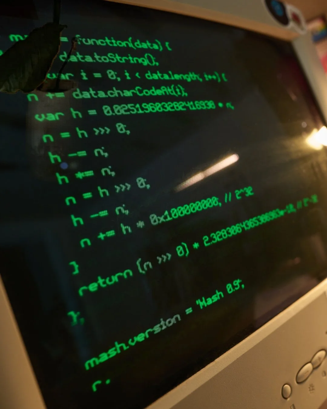 A computer screen displaying green code and mathematical functions in programming language.